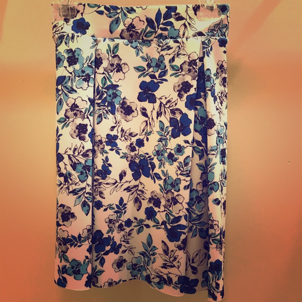White skirt with blue flowers
